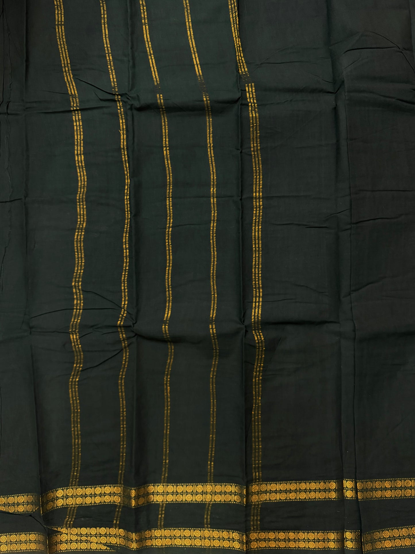 Sungudi saree with minimal zari border dark green