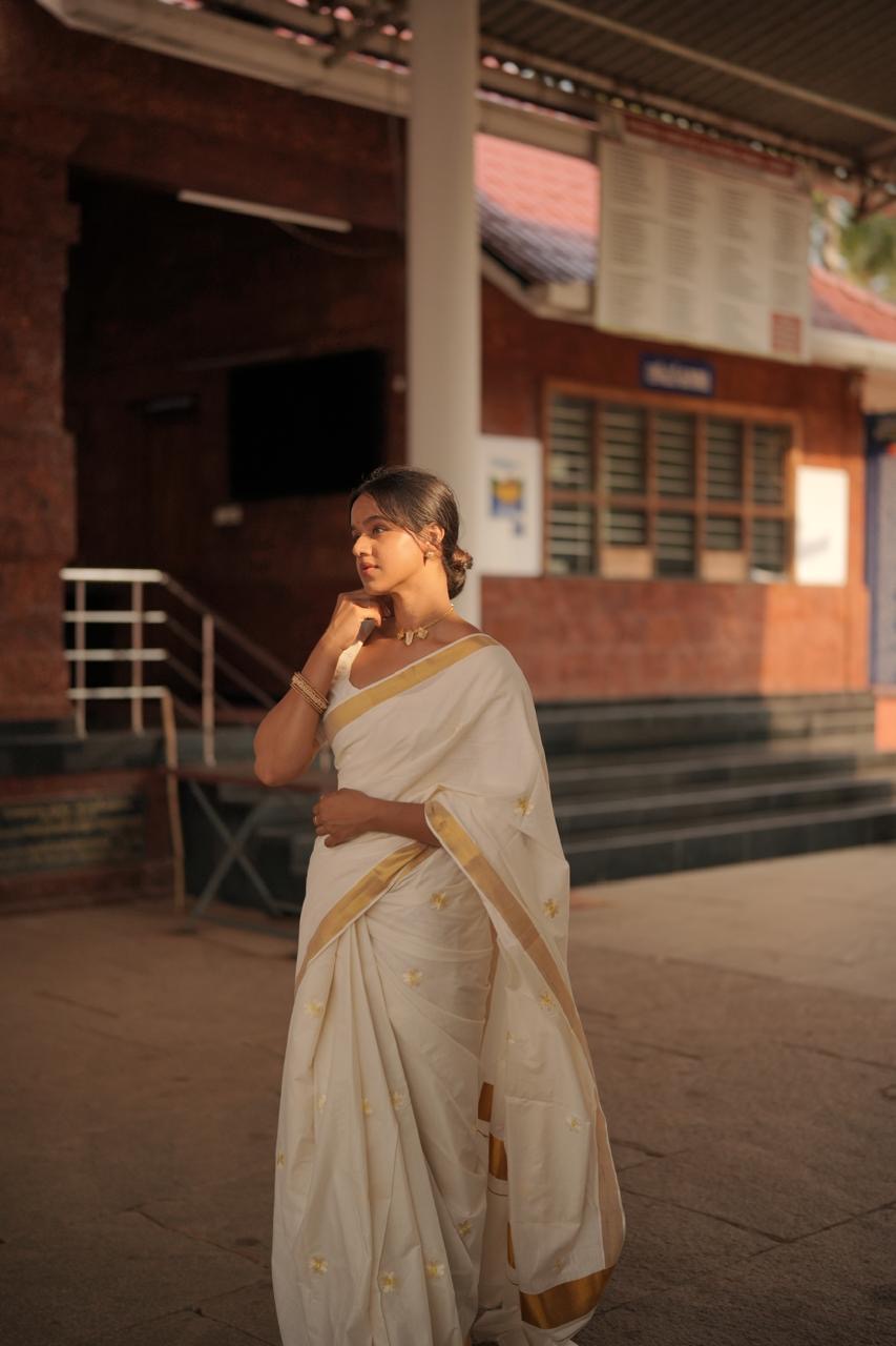 Kasavu saree in daisy embroidery