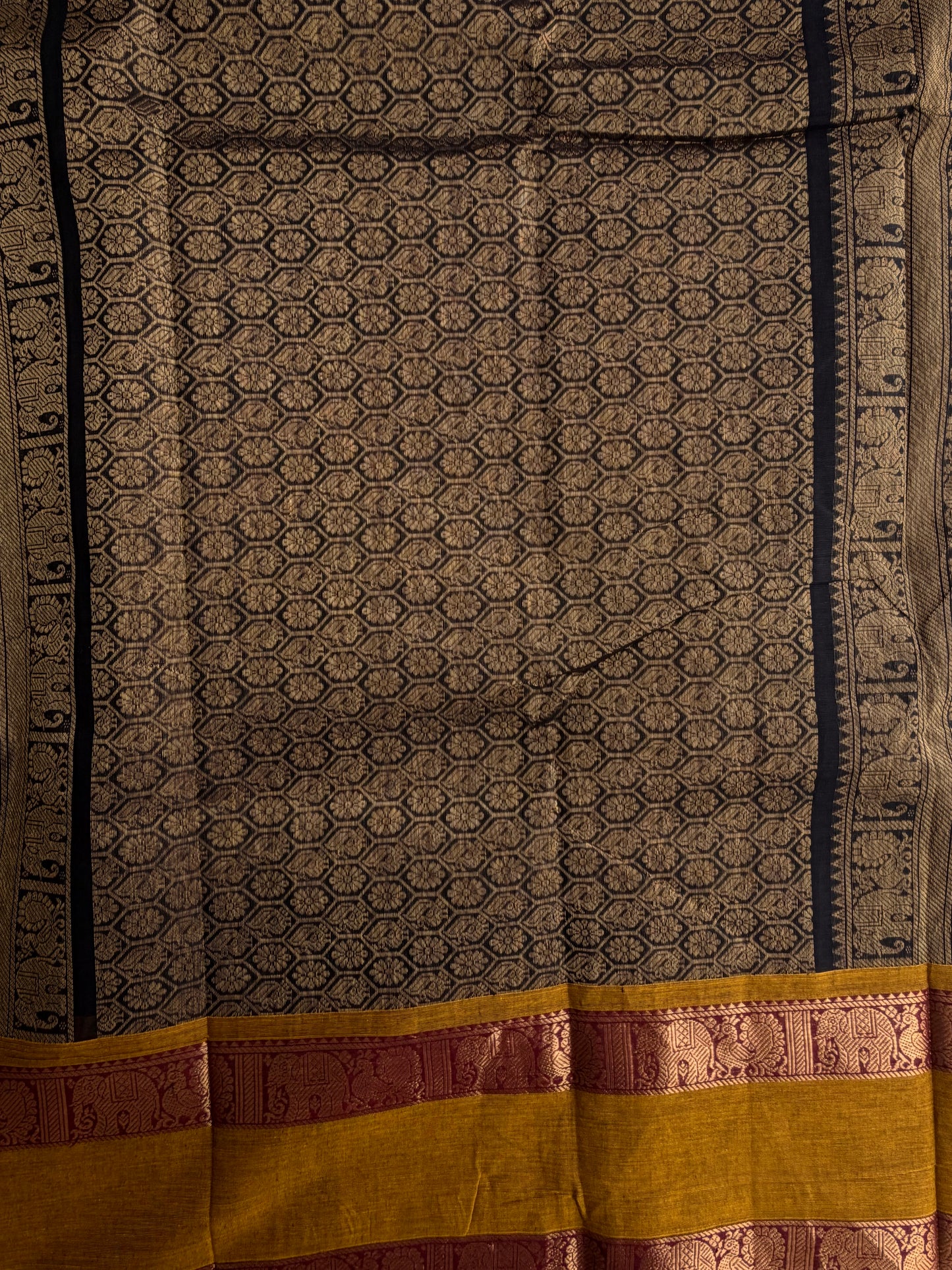 Kanchi cotton saree in zari check & butta weaves in black with a grand pallu