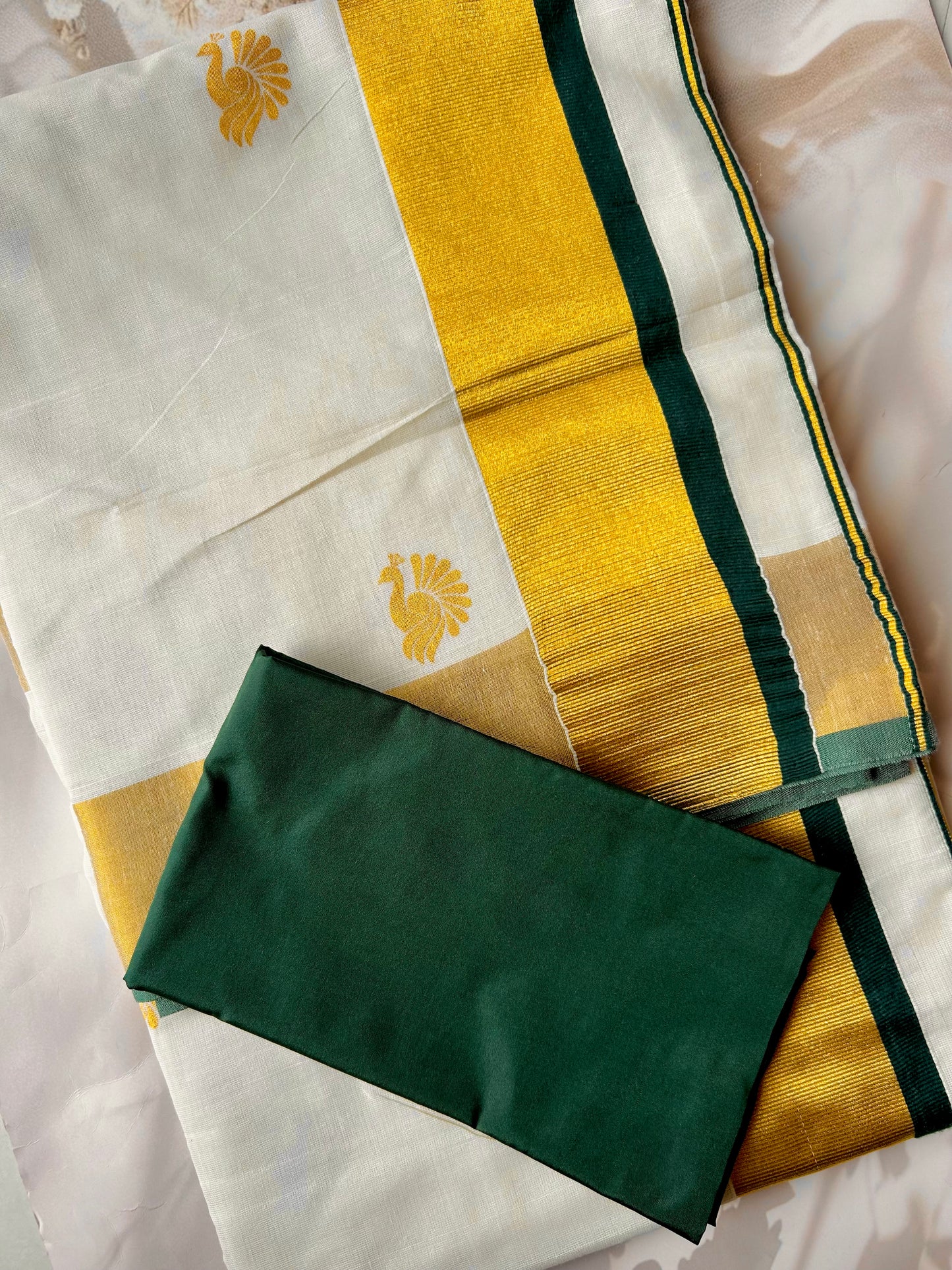 Kasavu saree in peacock print with green border