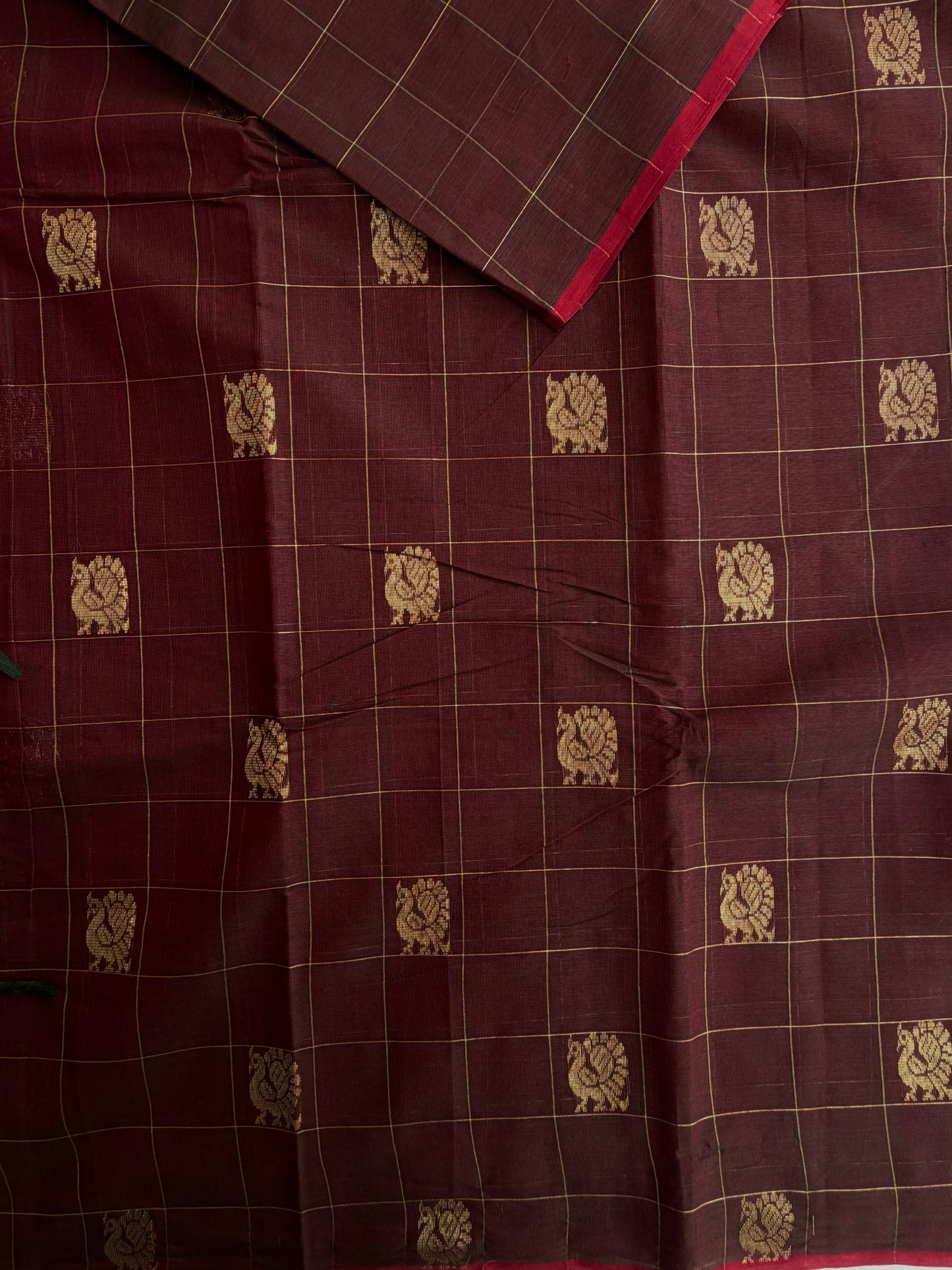 Kanchi cotton saree with checks & peacock zari weaves with a grand pallu