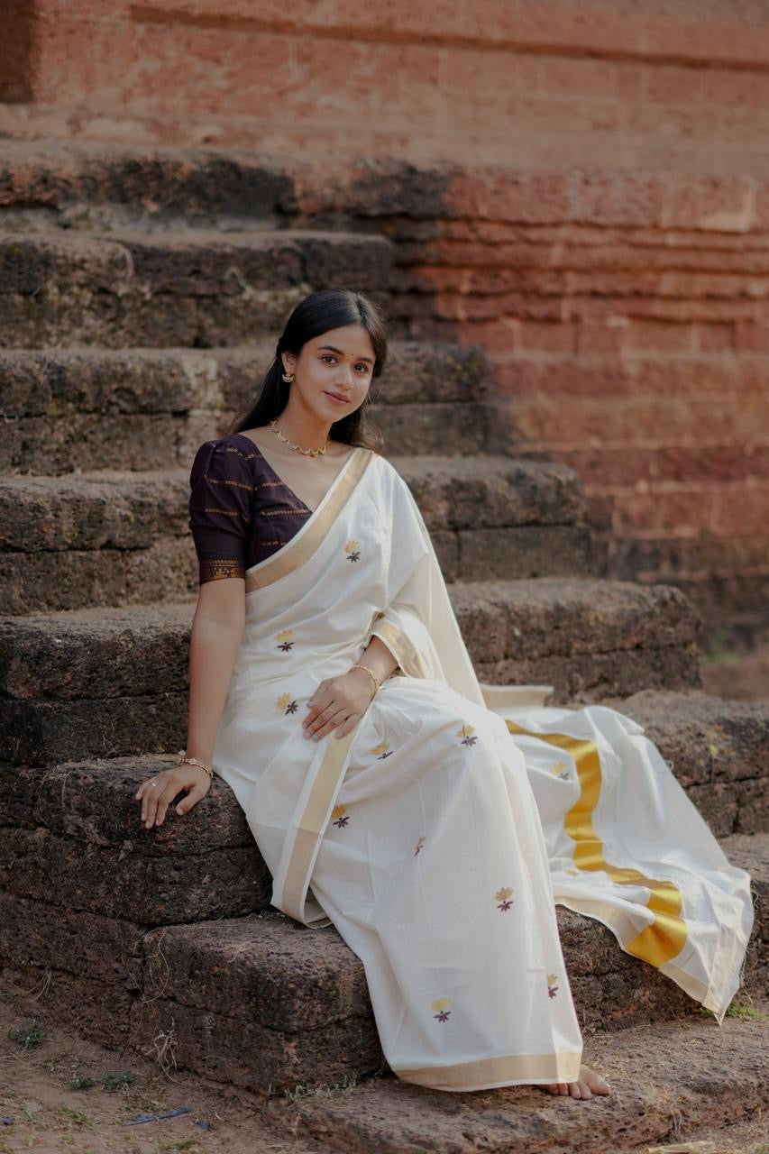 Kasavu saree in lotus embroidery
