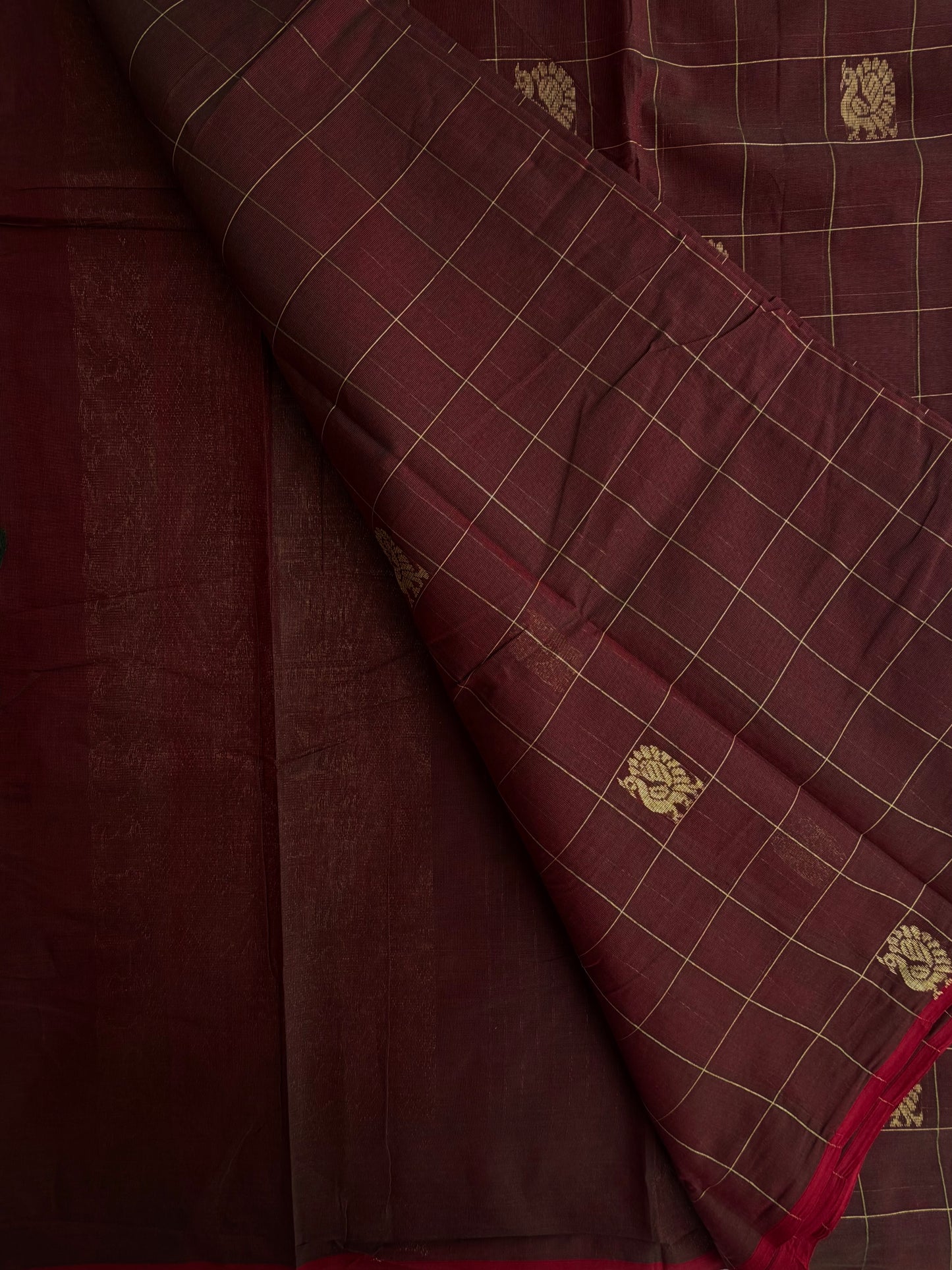 Kanchi cotton saree with checks & peacock zari weaves with a grand pallu