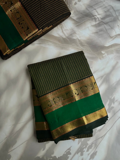 120 mercerised Kanchi cotton with checks on green base with grand pallu