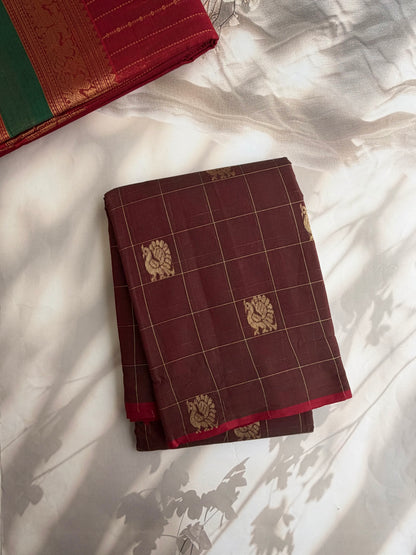 Kanchi cotton saree with checks & peacock zari weaves with a grand pallu