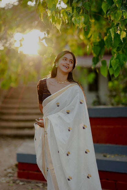 Kasavu saree in lotus embroidery