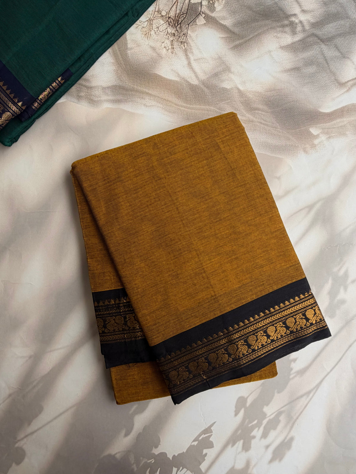 Mustard Kanchi cotton saree with minimal zari black border