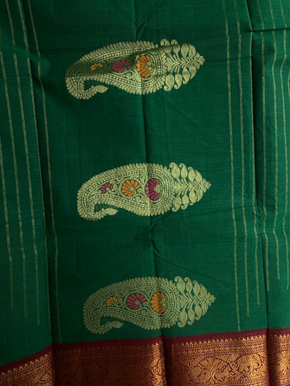Kanchi cotton saree with butta weaves & grand pallu dark green