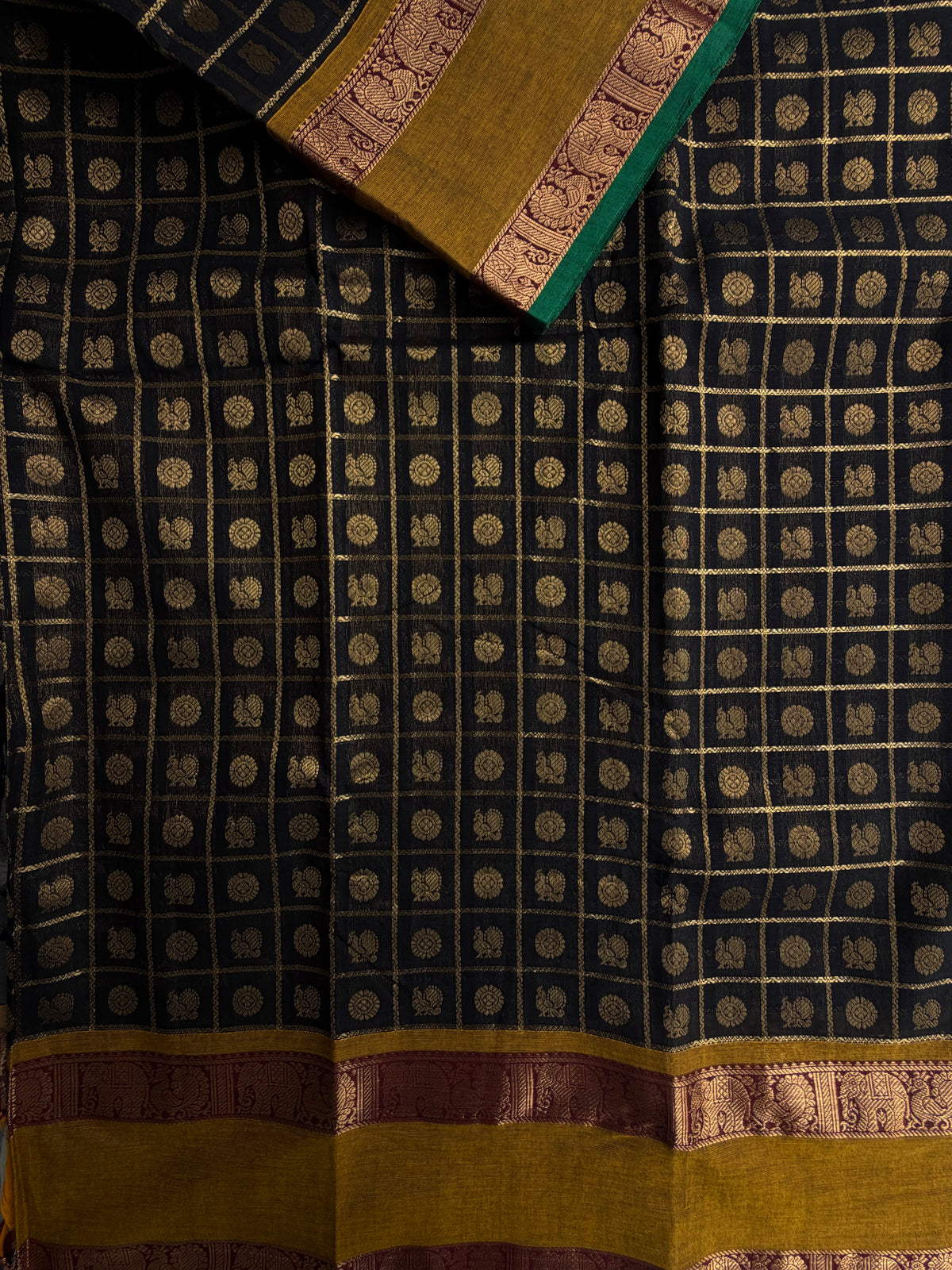 Kanchi cotton saree in zari check & butta weaves in black with a grand pallu