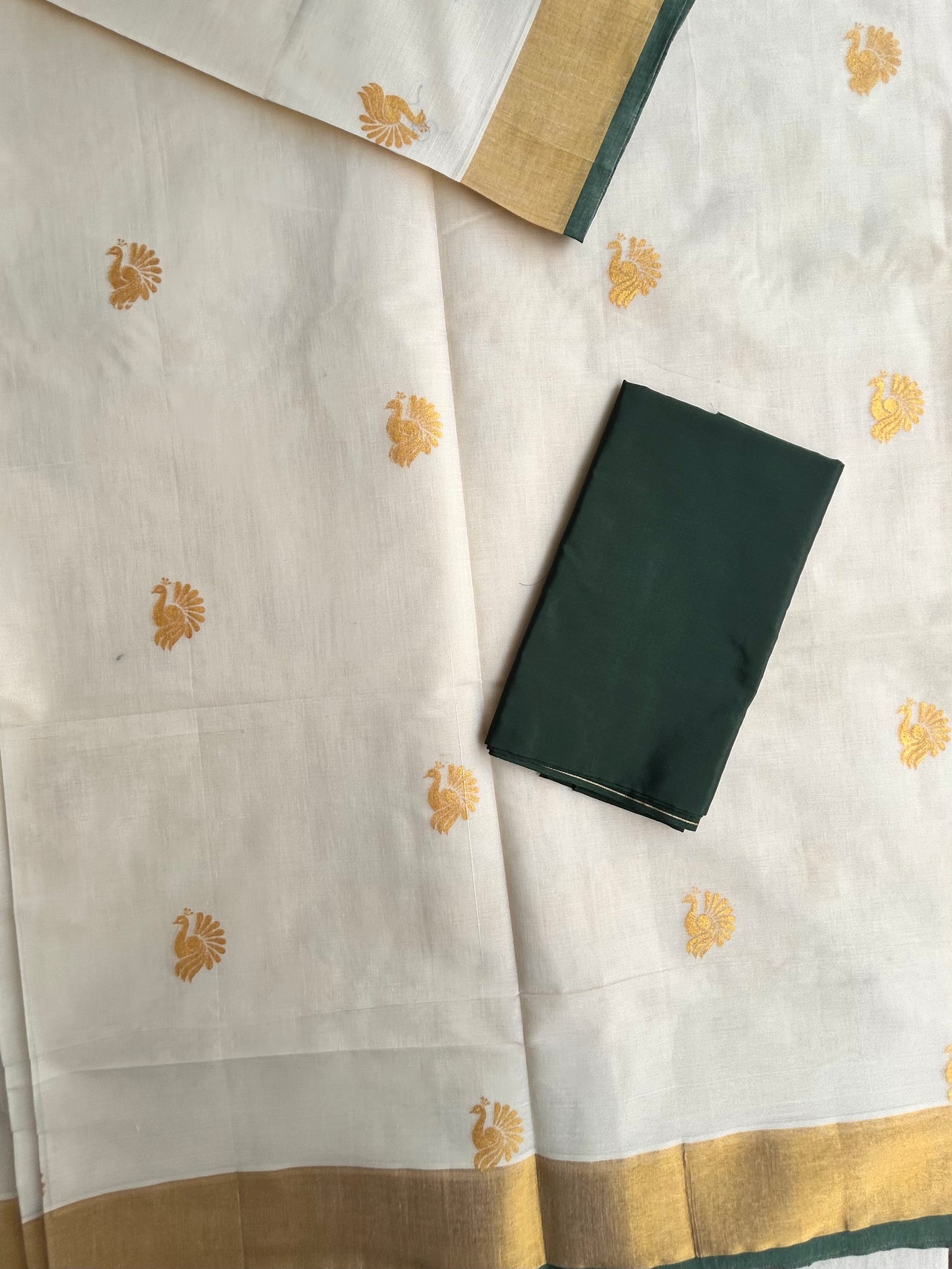 Kasavu saree in peacock print with green border