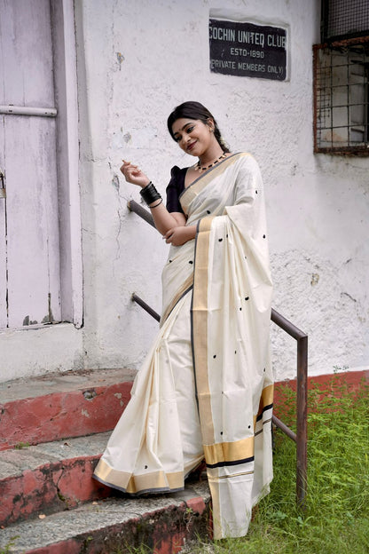 Kasavu saree in mango butta embroidery - black