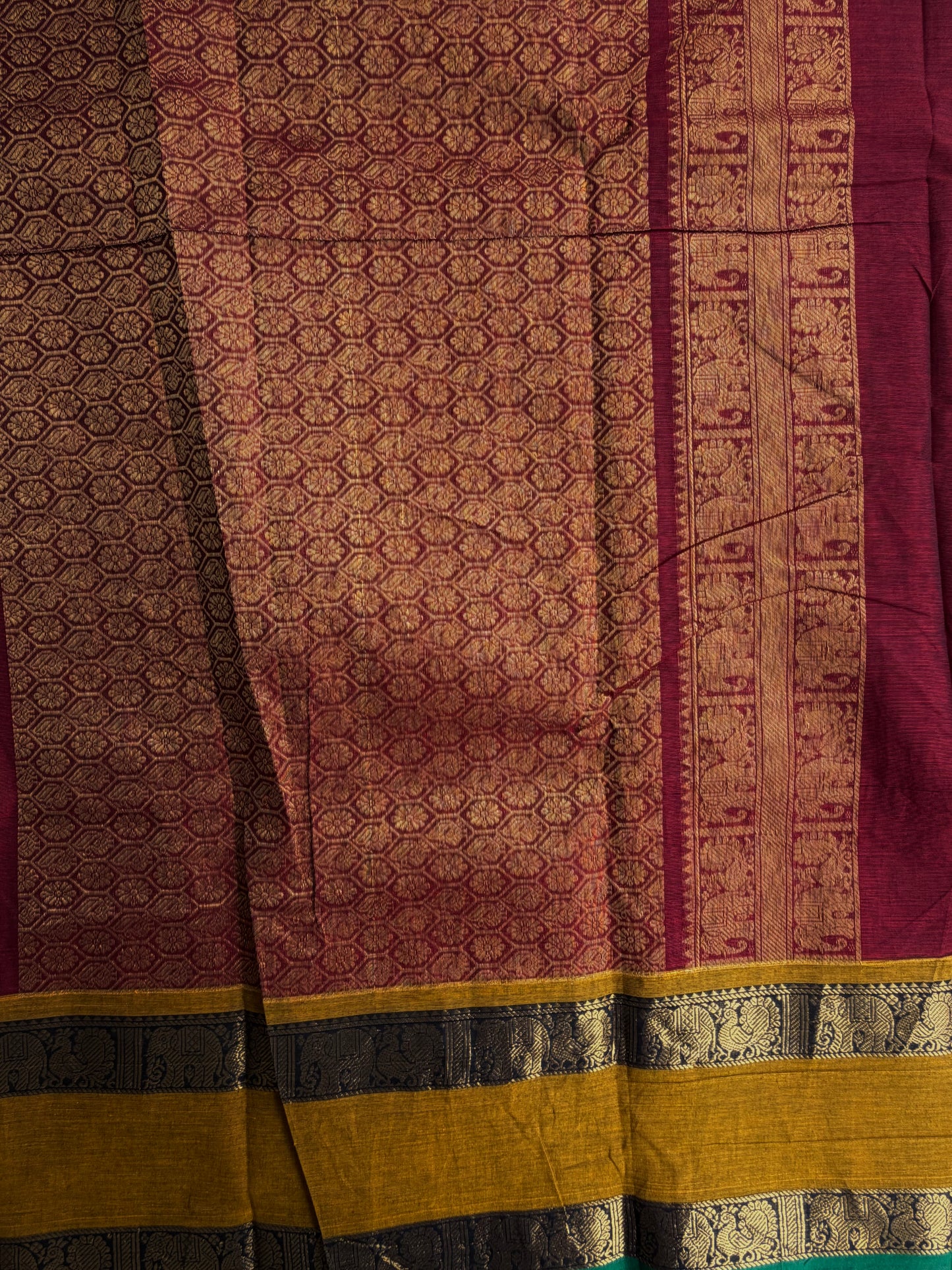Kanchi cotton saree in zari check & butta weaves in with a grand pallu maroon