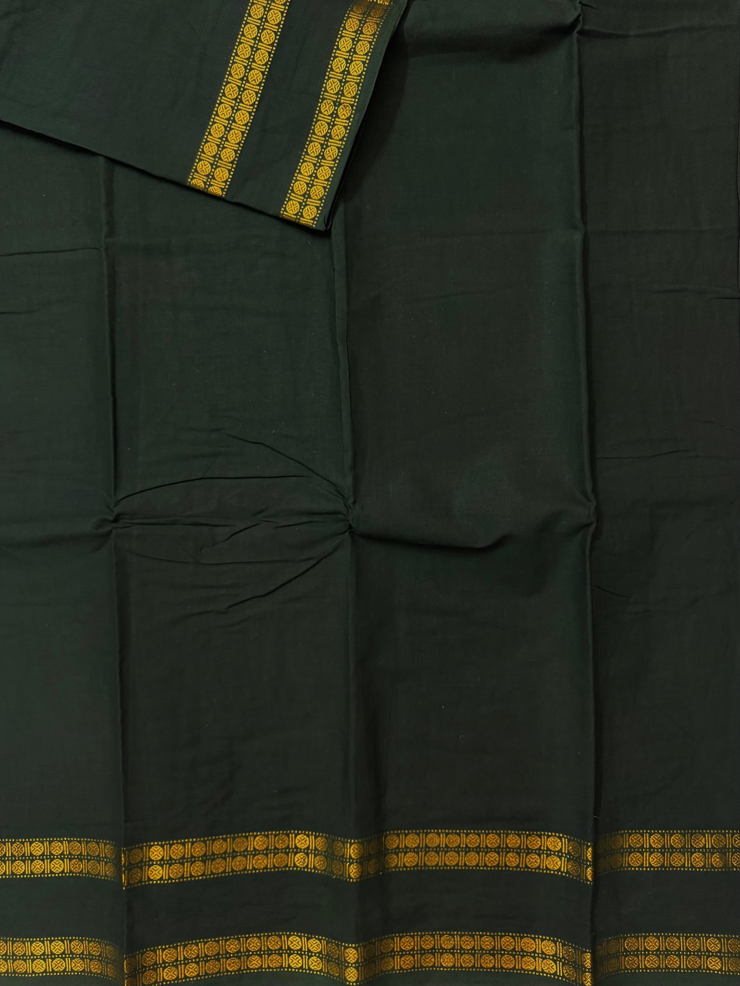 Sungudi saree with minimal zari border dark green