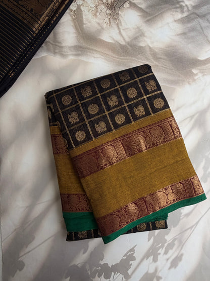 Kanchi cotton saree in zari check & butta weaves in black with a grand pallu