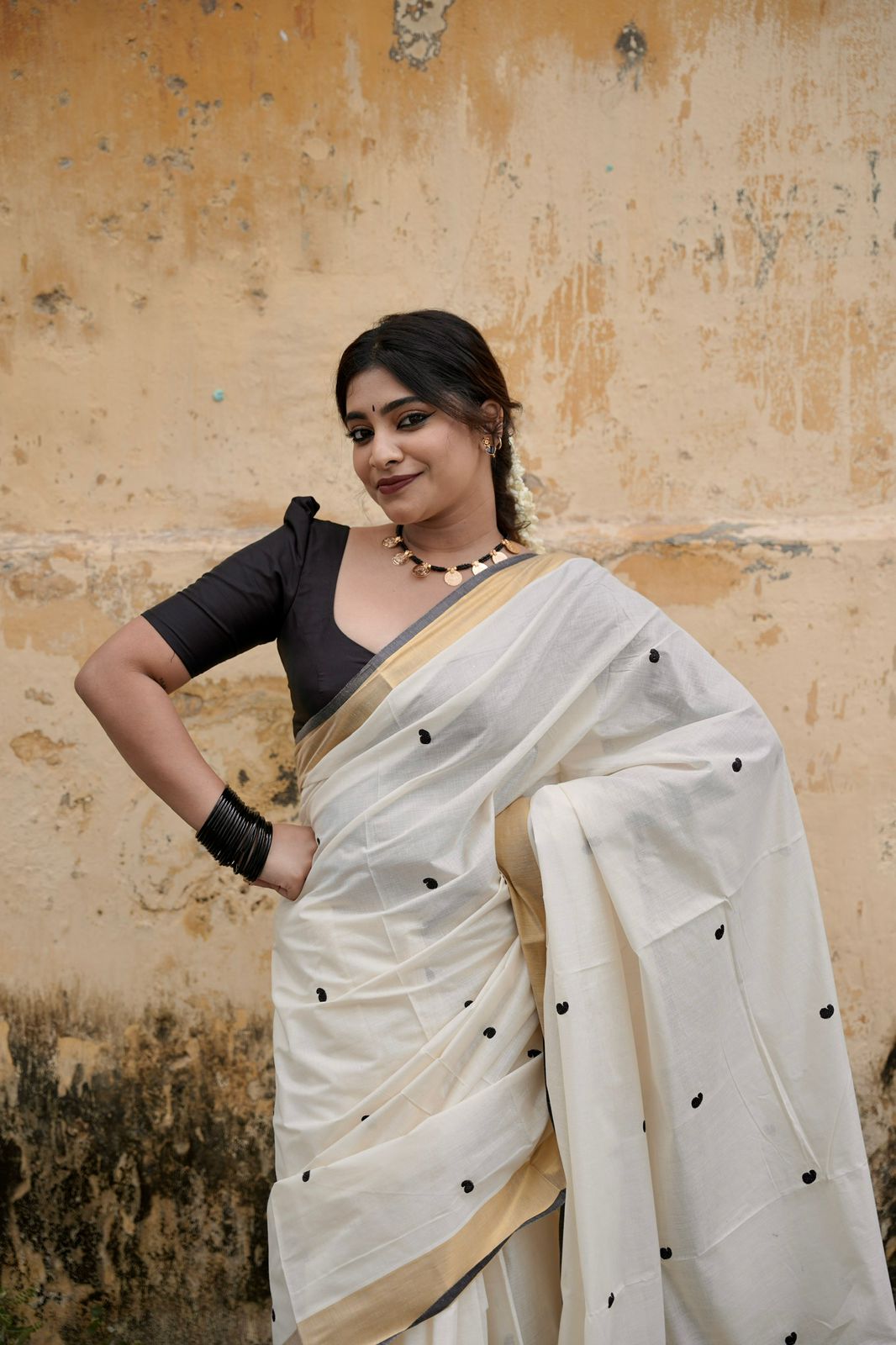 Kasavu saree in mango butta embroidery - black