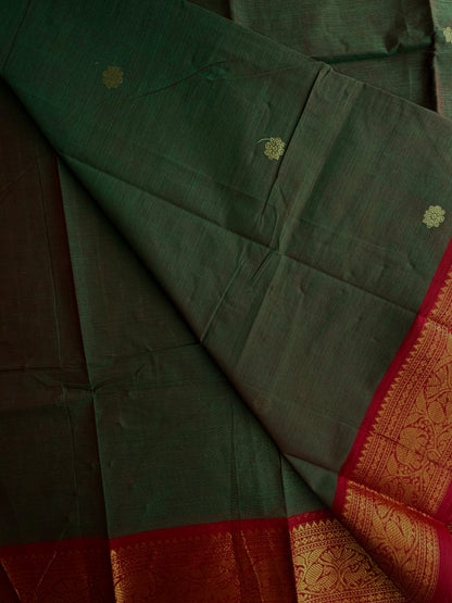 Kanchi cotton saree with butta weaves & zari pallu dual tone green