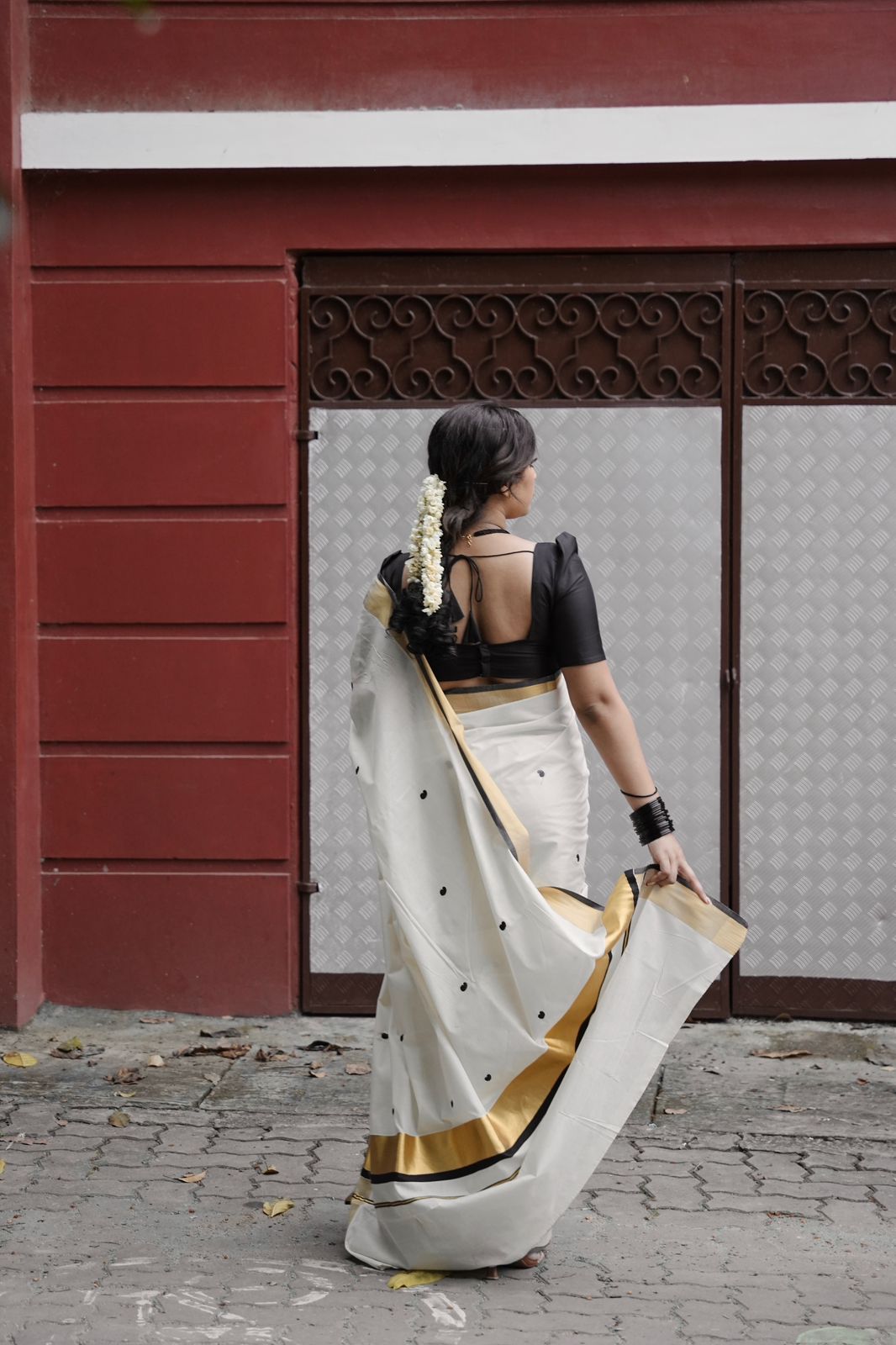 Kasavu saree in mango butta embroidery - black