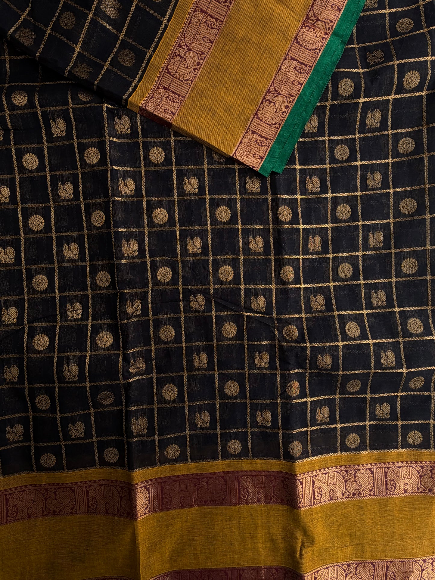Kanchi cotton saree in zari check & butta weaves in black with a grand pallu