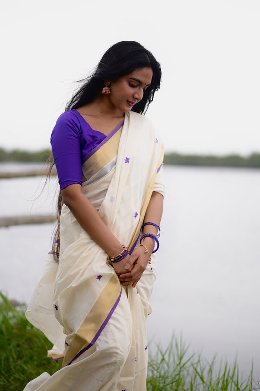 Kasavu saree in lotus embroidery - Russian violet
