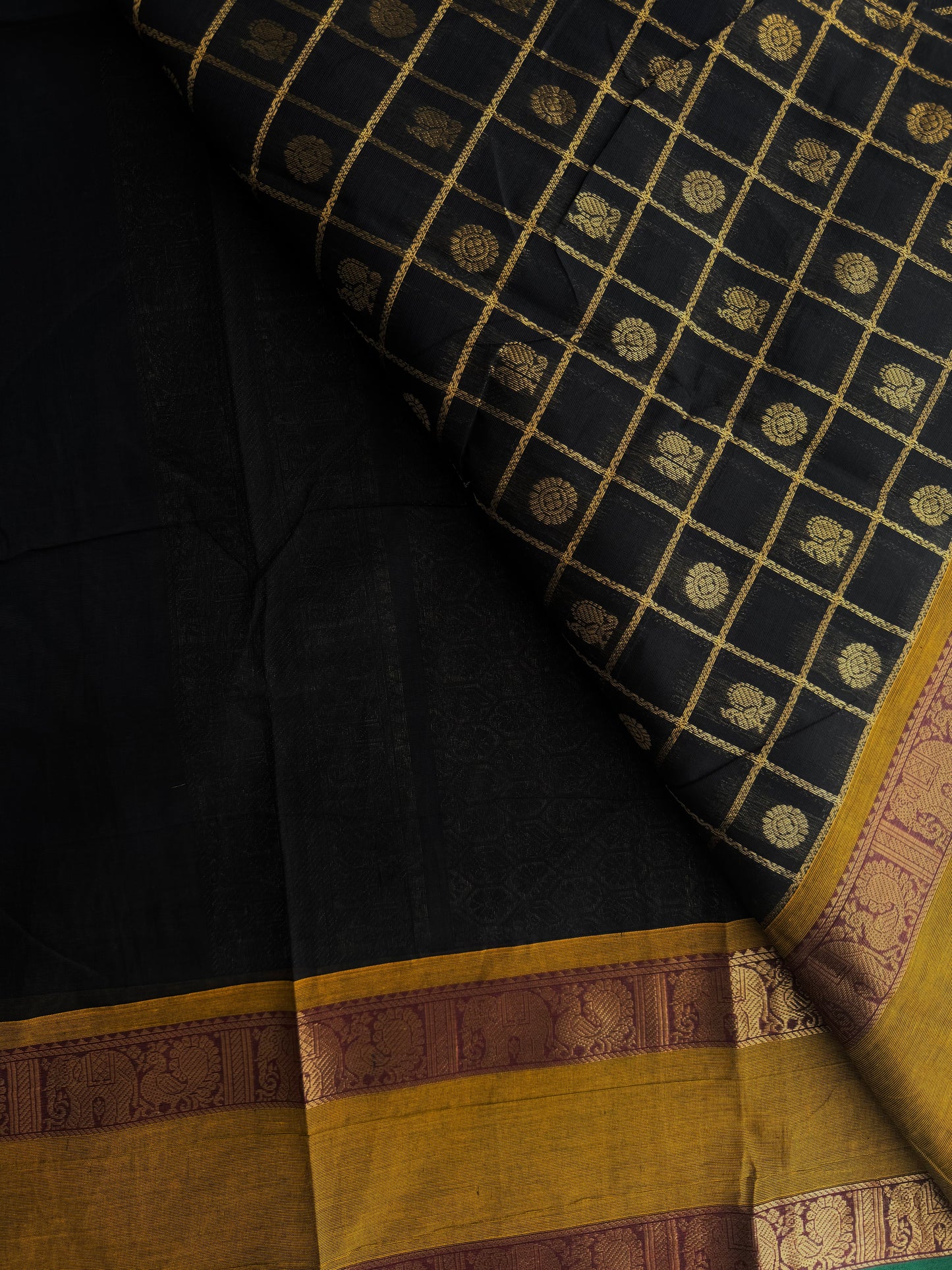 Kanchi cotton saree in zari check & butta weaves in black with a grand pallu