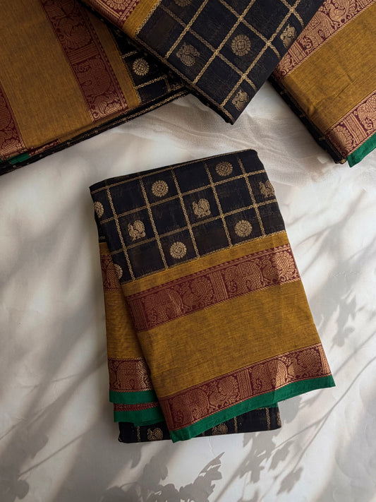 Kanchi cotton saree in zari check & butta weaves in black with a grand pallu
