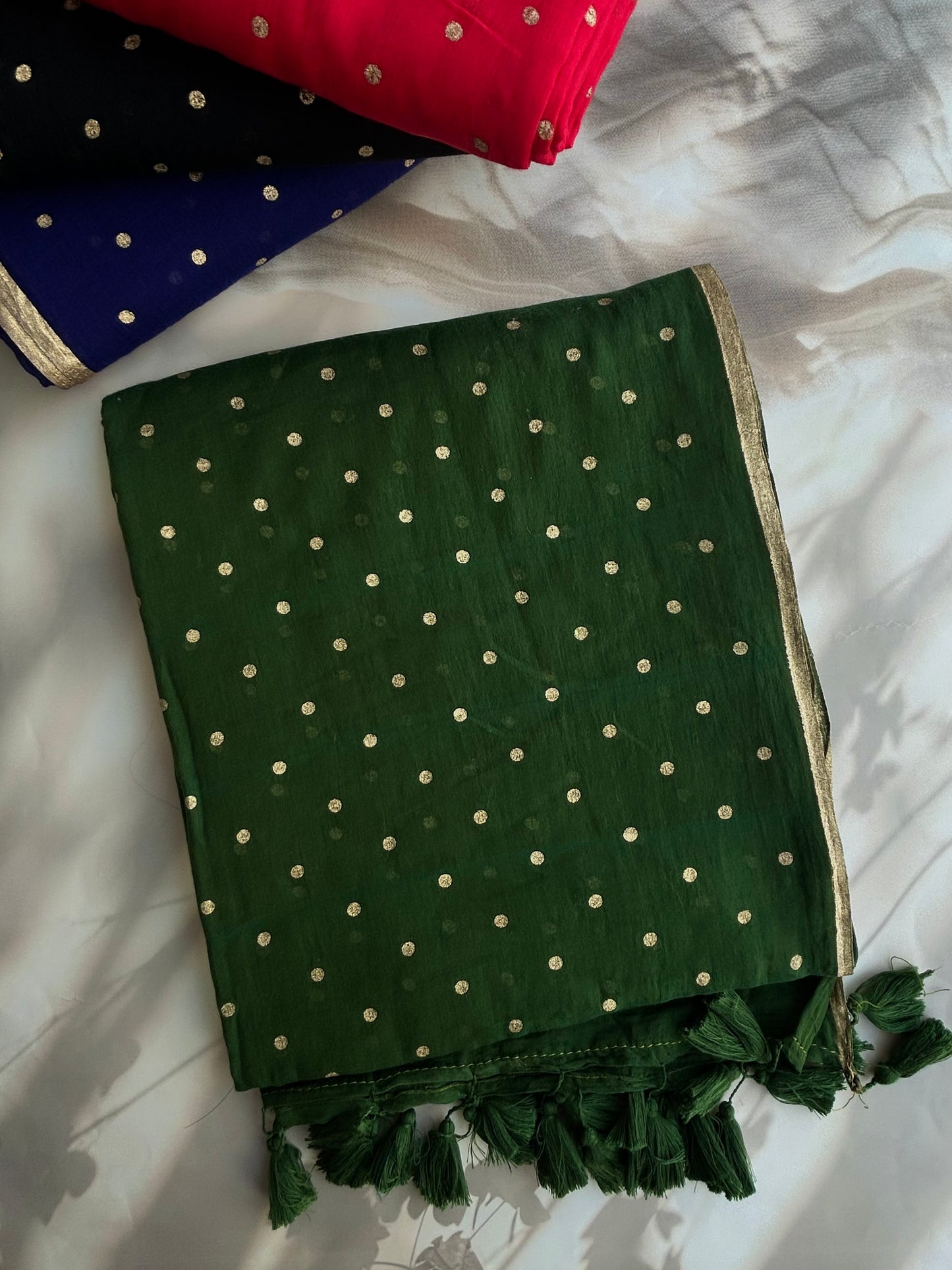 Green Mul mul saree in golden polka dots