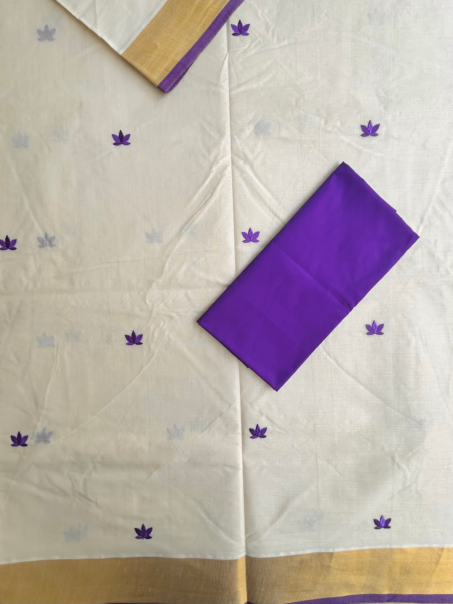 Kasavu saree in lotus embroidery - Russian violet