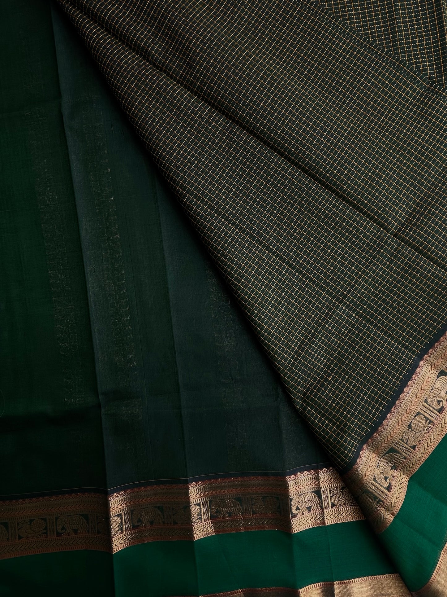 120 mercerised Kanchi cotton with checks on green base with grand pallu