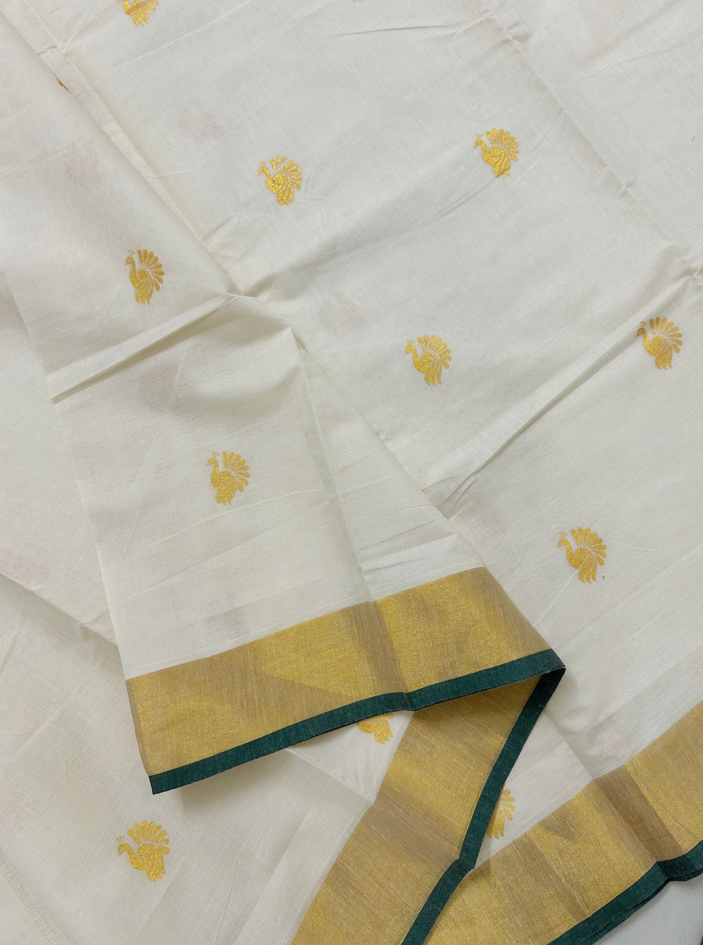 Kasavu saree in peacock print with green border
