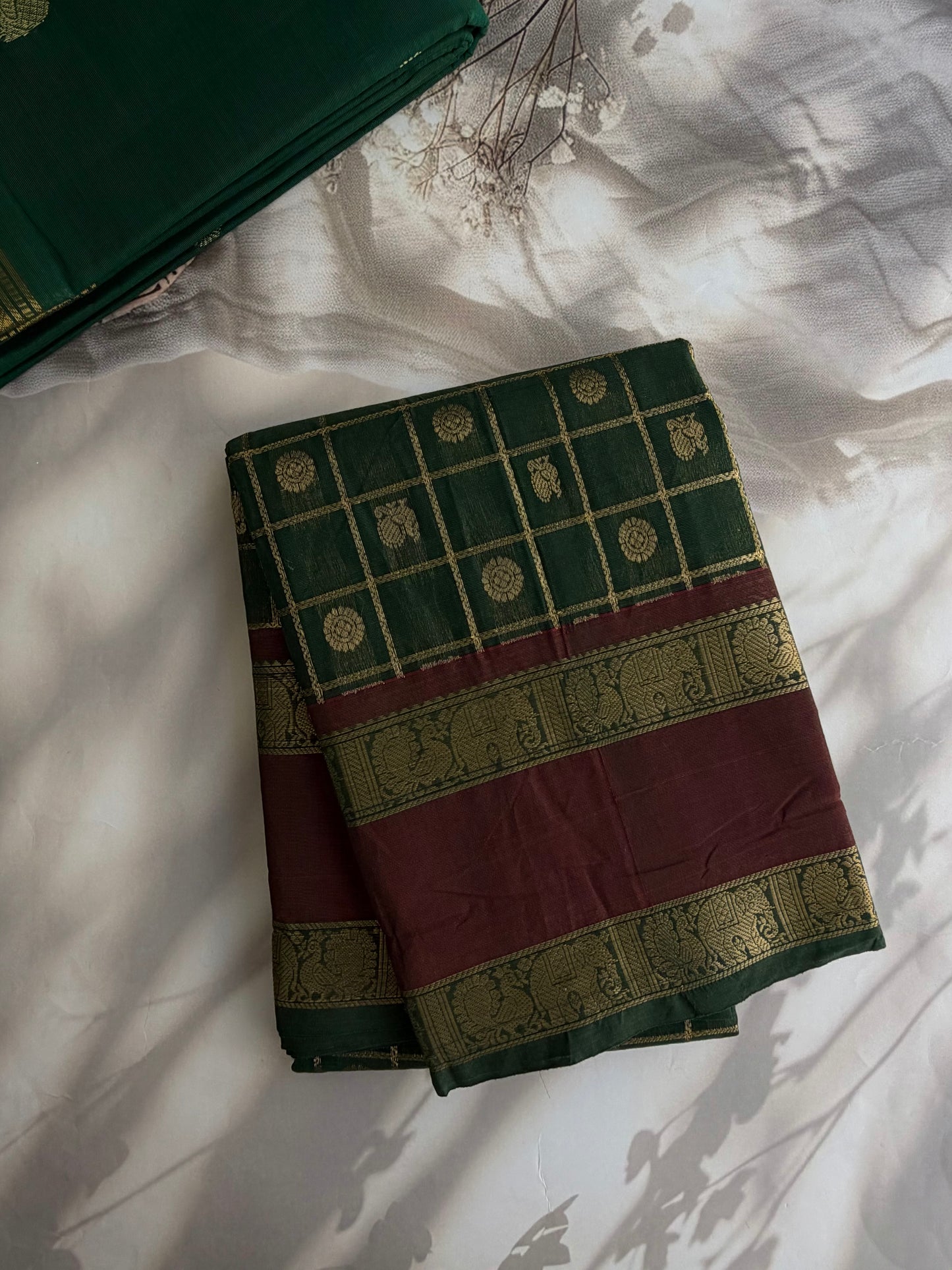 Kanchi cotton saree with checks & butta weaves with a grand pallu - green