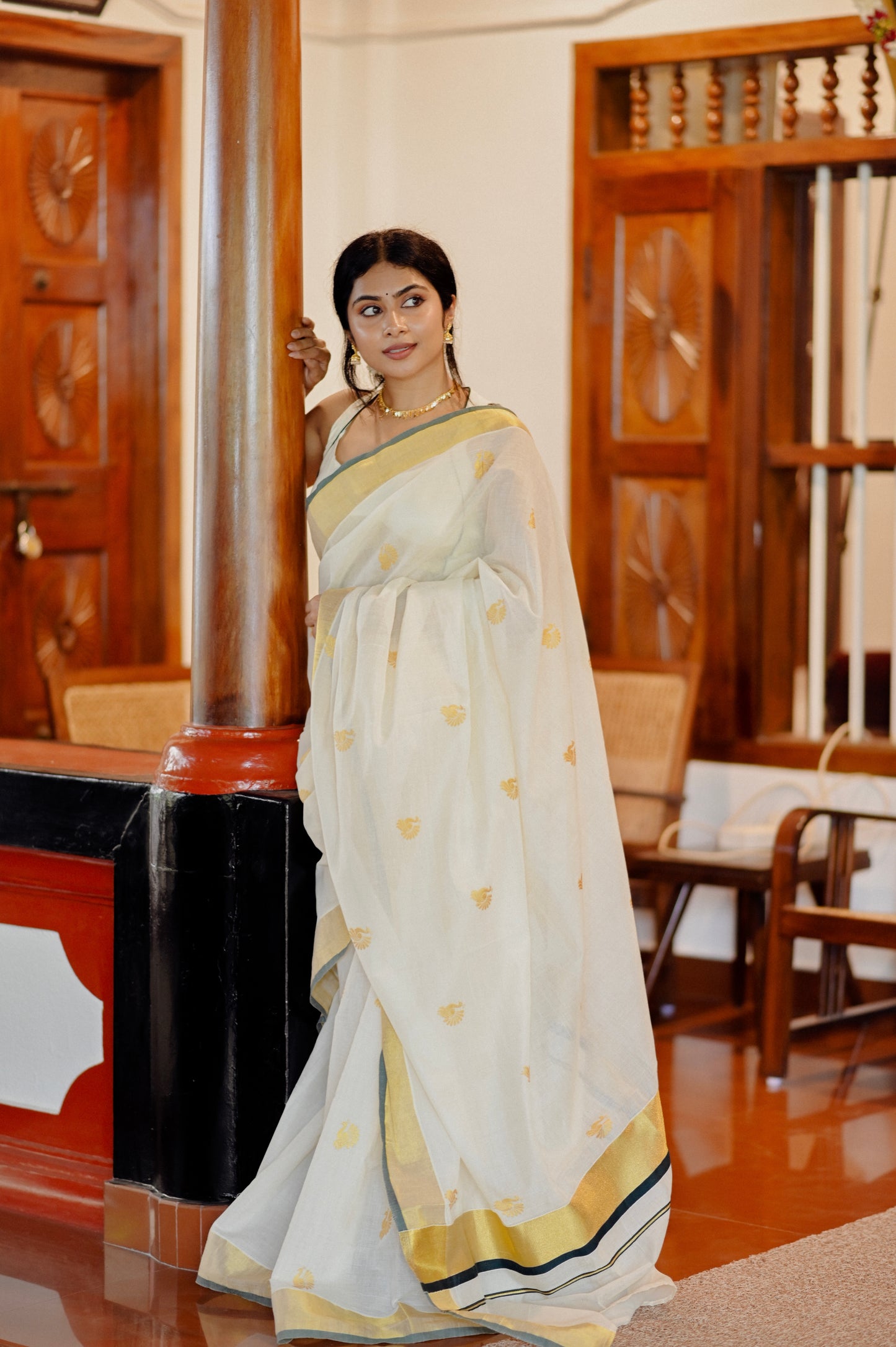 Kasavu saree in peacock print with green border