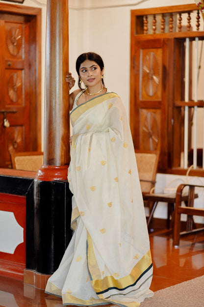Kasavu saree in peacock print with green border