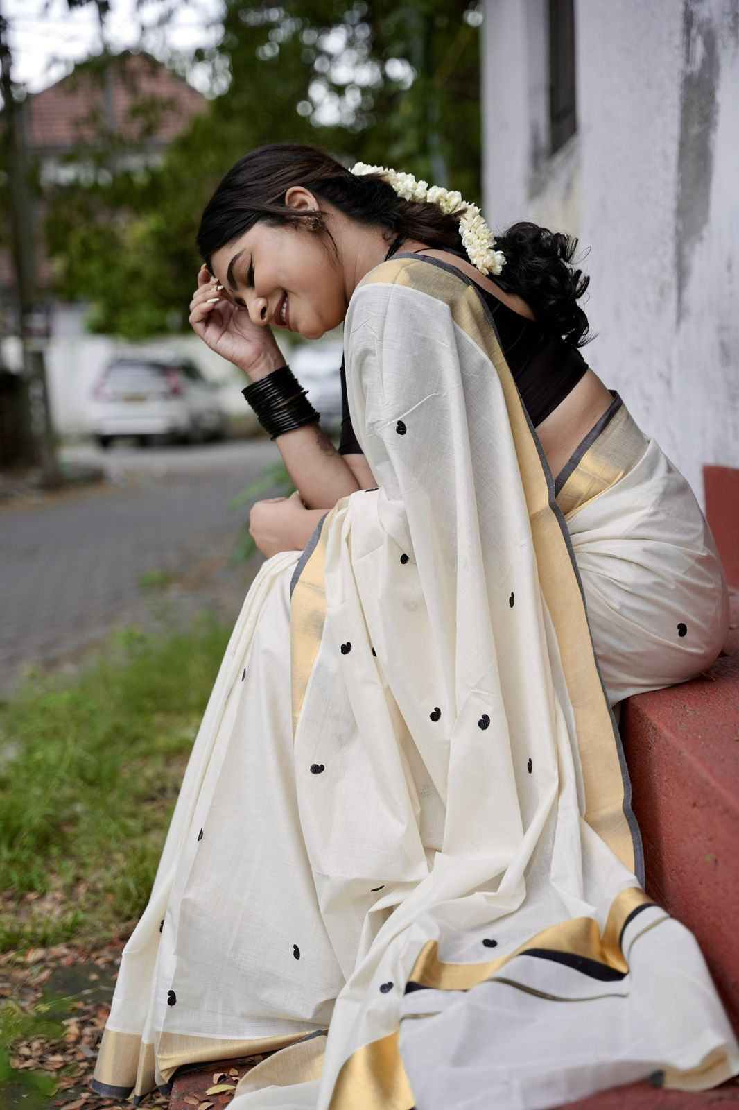 Kasavu saree in mango butta embroidery - black