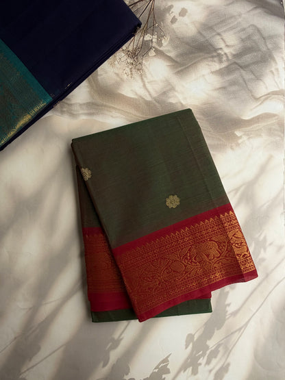 Kanchi cotton saree with butta weaves & zari pallu dual tone green