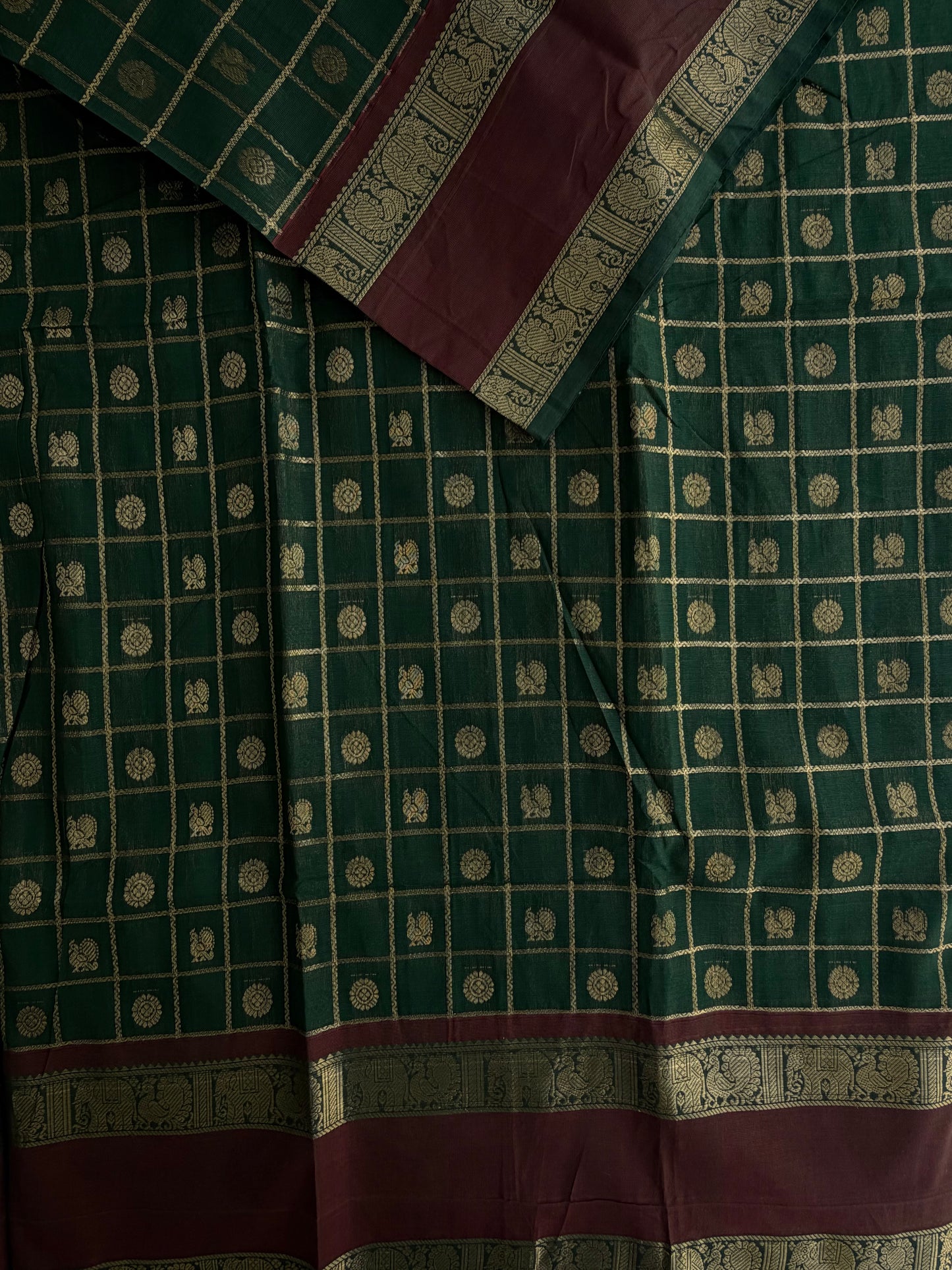 Kanchi cotton saree with checks & butta weaves with a grand pallu - green