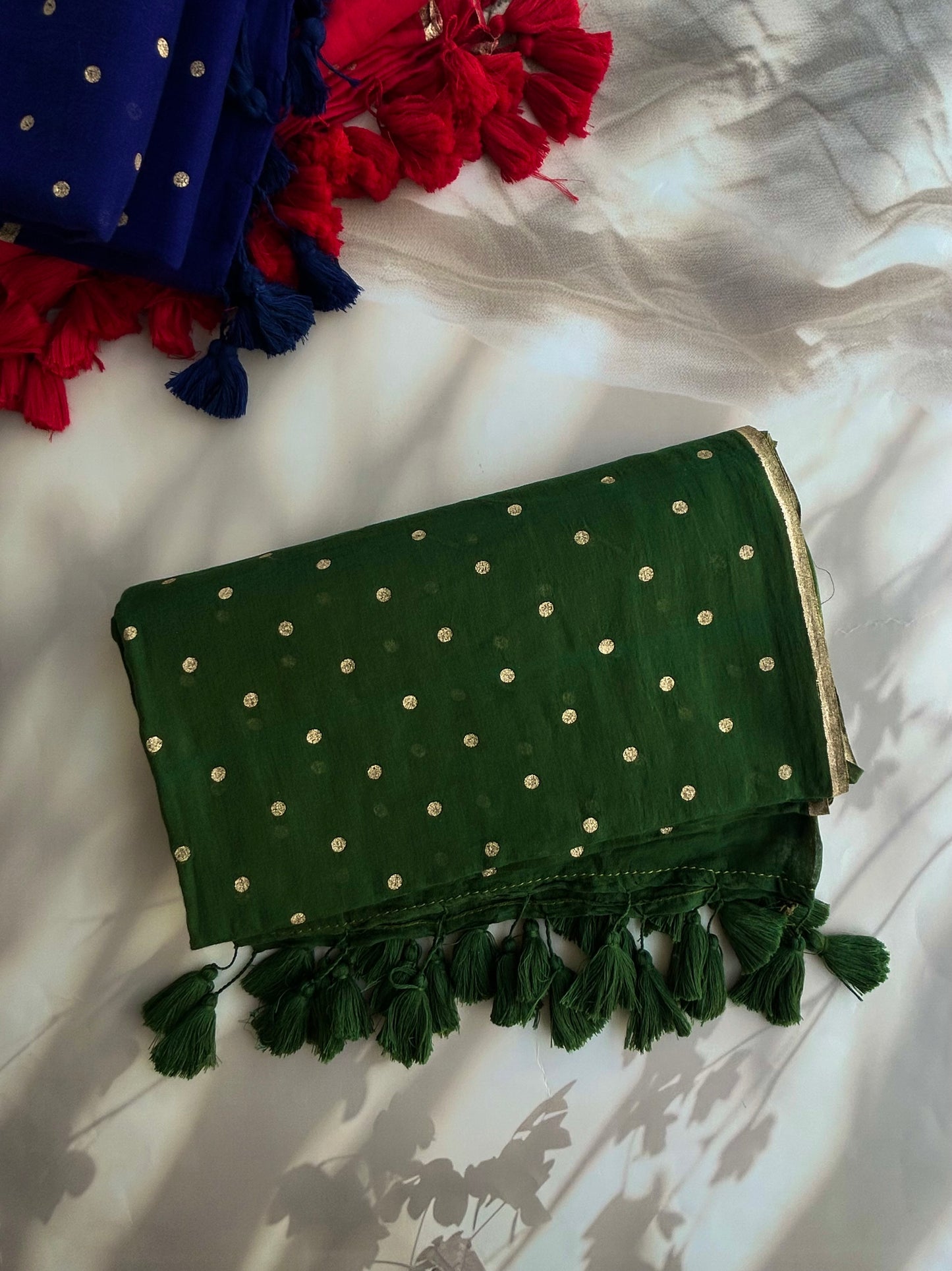 Green Mul mul saree in golden polka dots