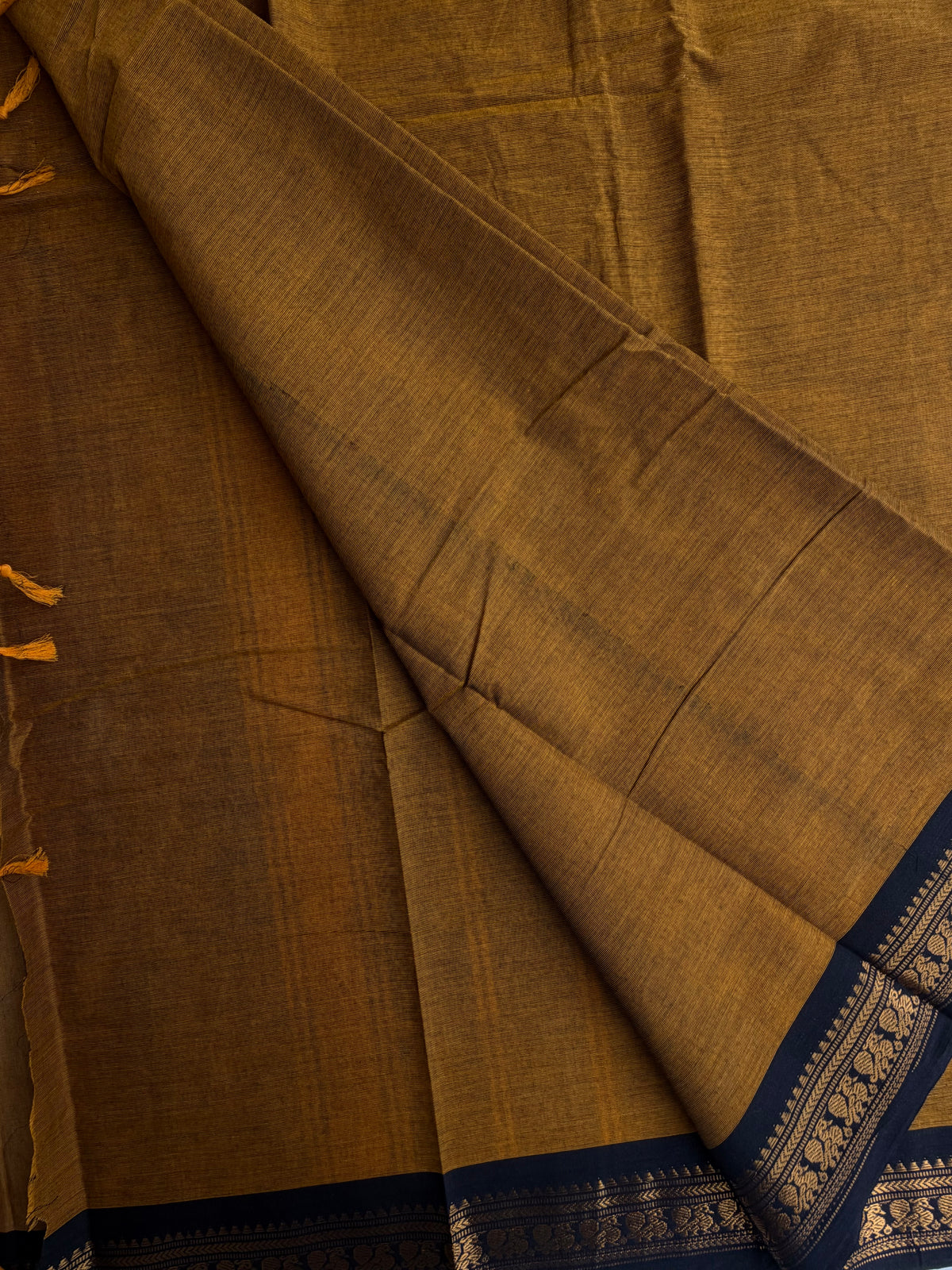 Mustard Kanchi cotton saree with minimal zari black border