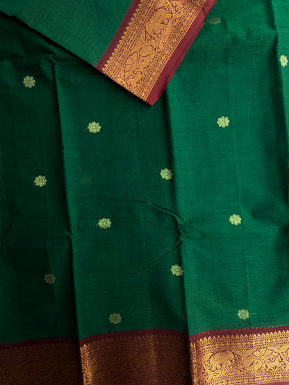 Kanchi cotton saree with butta weaves & grand pallu dark green