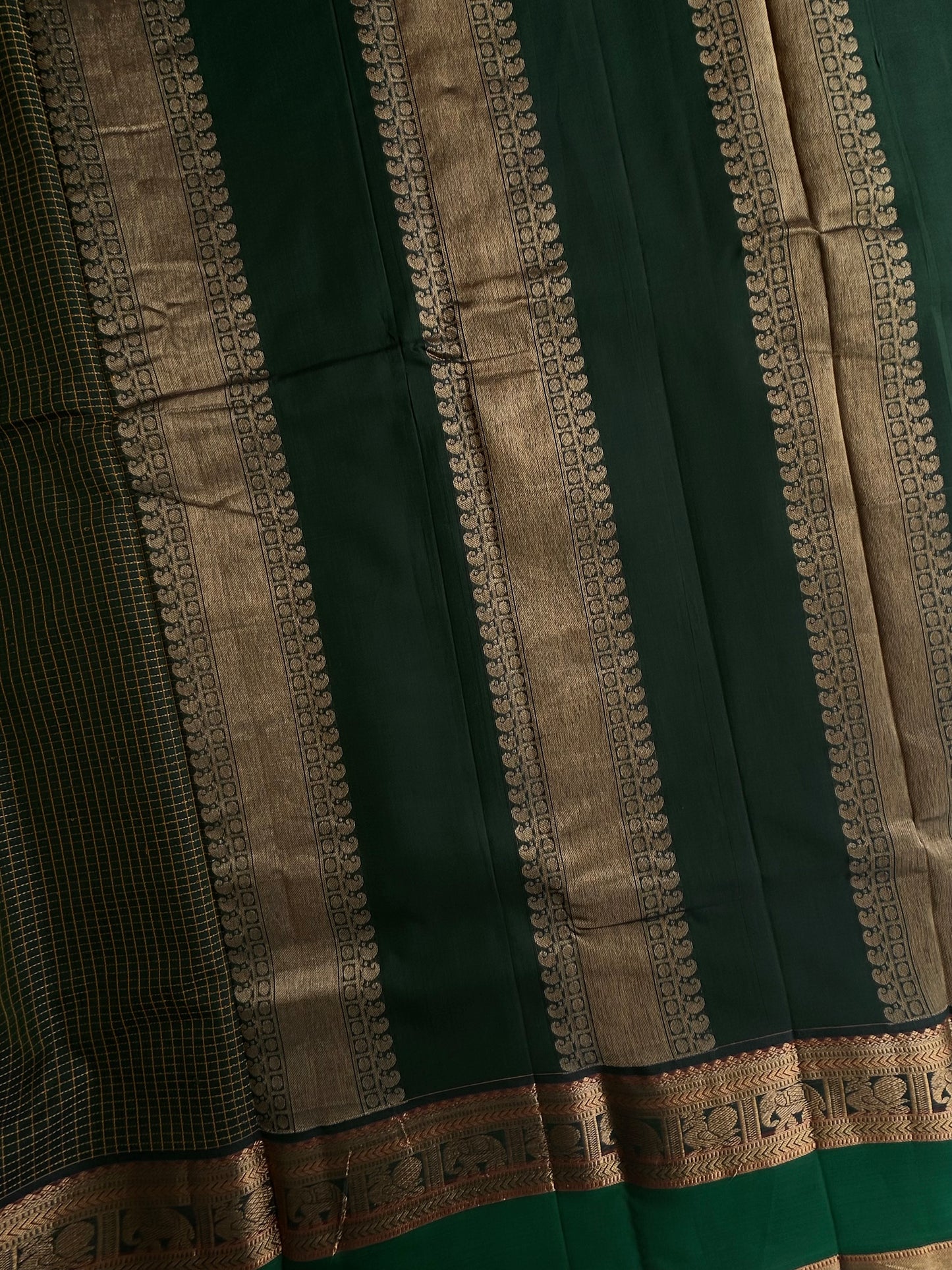 120 mercerised Kanchi cotton with checks on green base with grand pallu