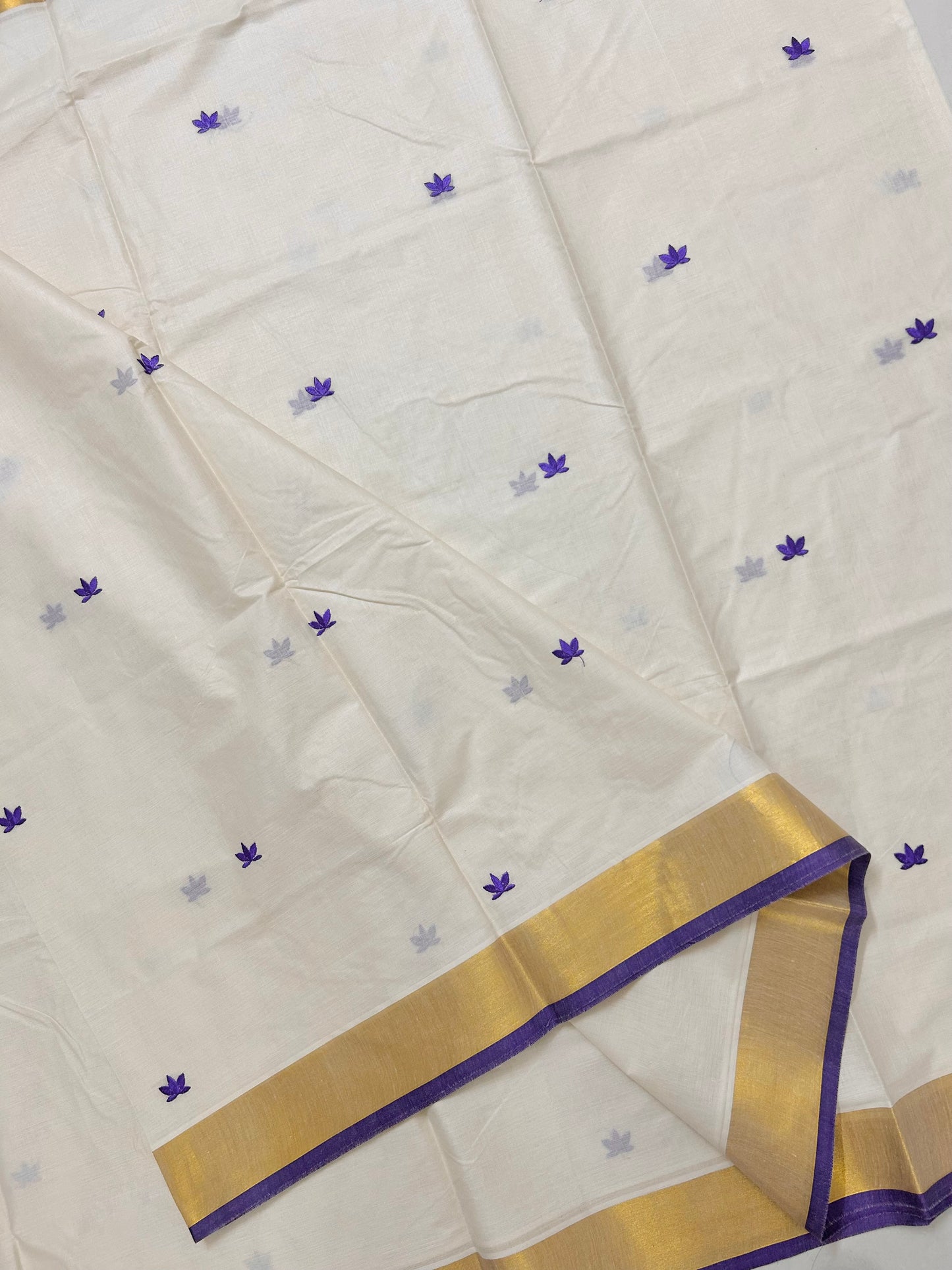 Kasavu saree in lotus embroidery - Russian violet