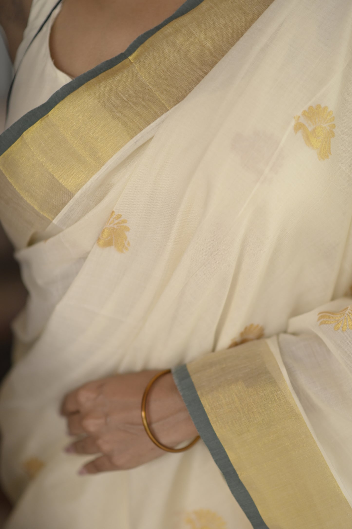 Kasavu saree in peacock print with green border