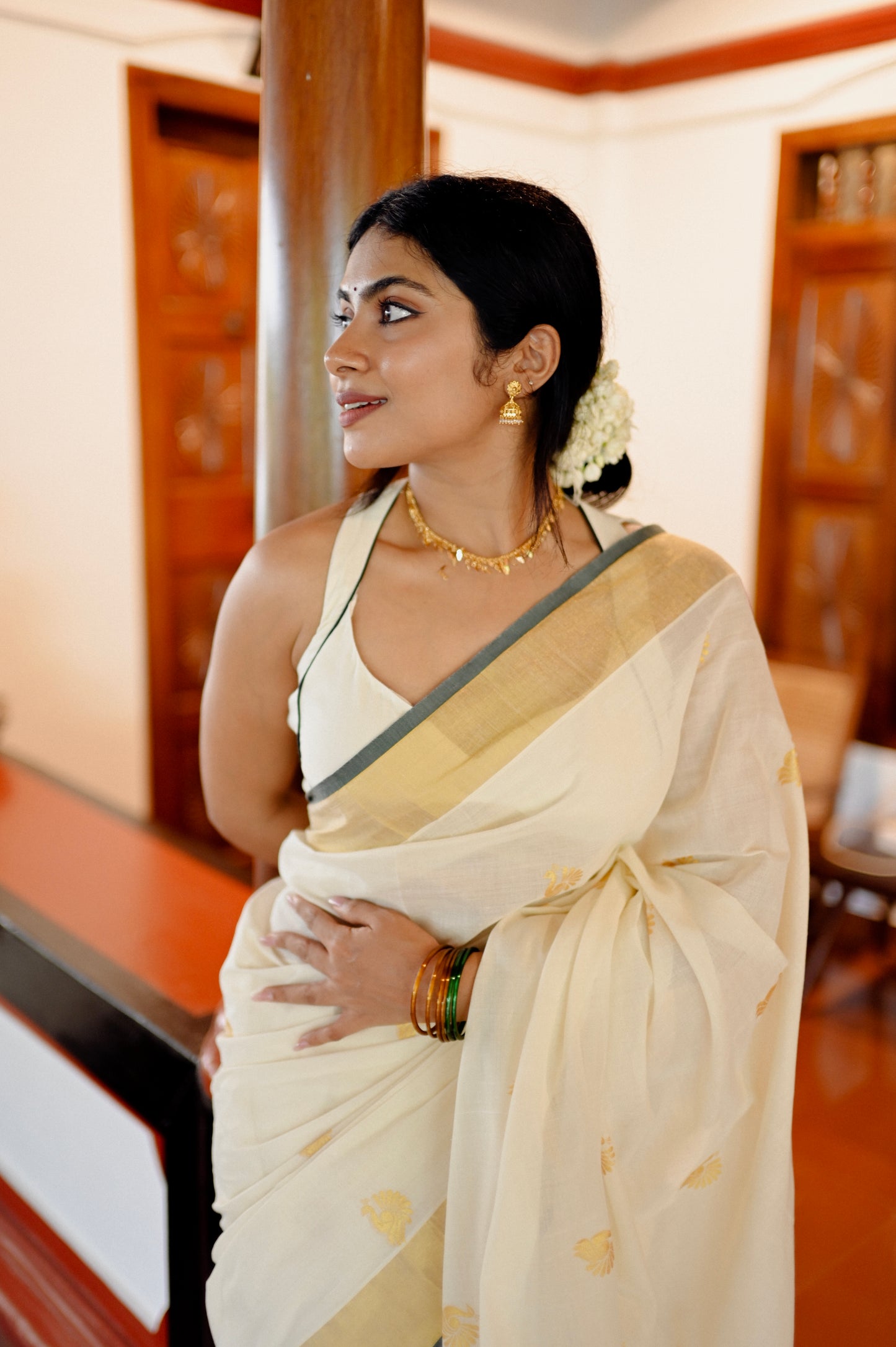Kasavu saree in peacock print with green border