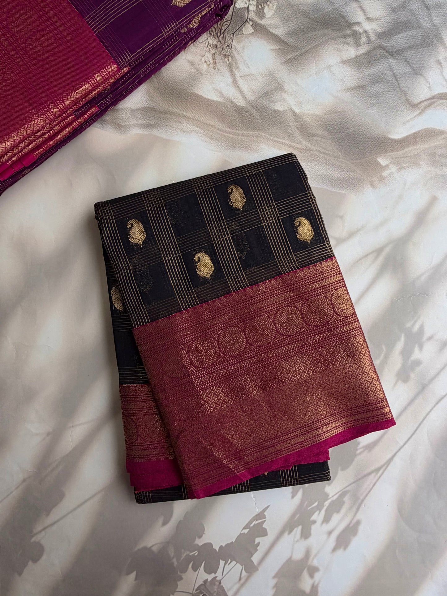 Kanchi cotton saree in checks & butta weaves with grand pallu black with pink border