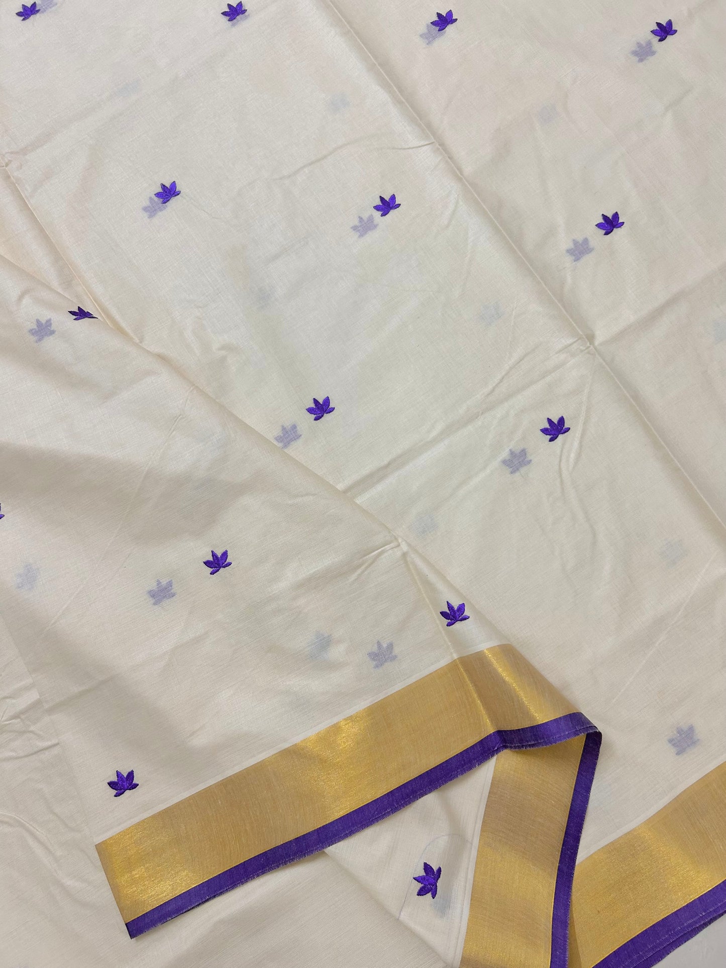 Kasavu saree in lotus embroidery - Russian violet