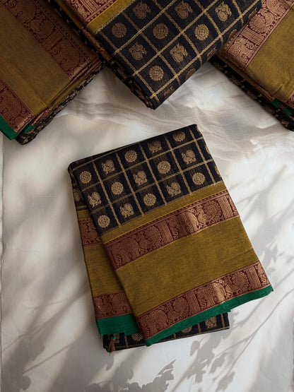 Kanchi cotton saree in zari check & butta weaves in black with a grand pallu