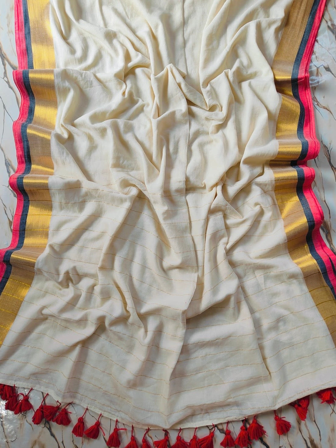 Off white Mul mul saree with zari stripes on pallu