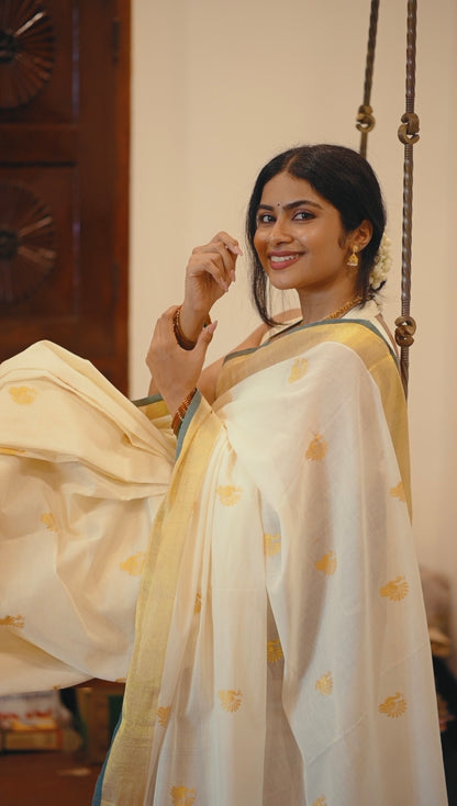 Kasavu saree in peacock print with green border