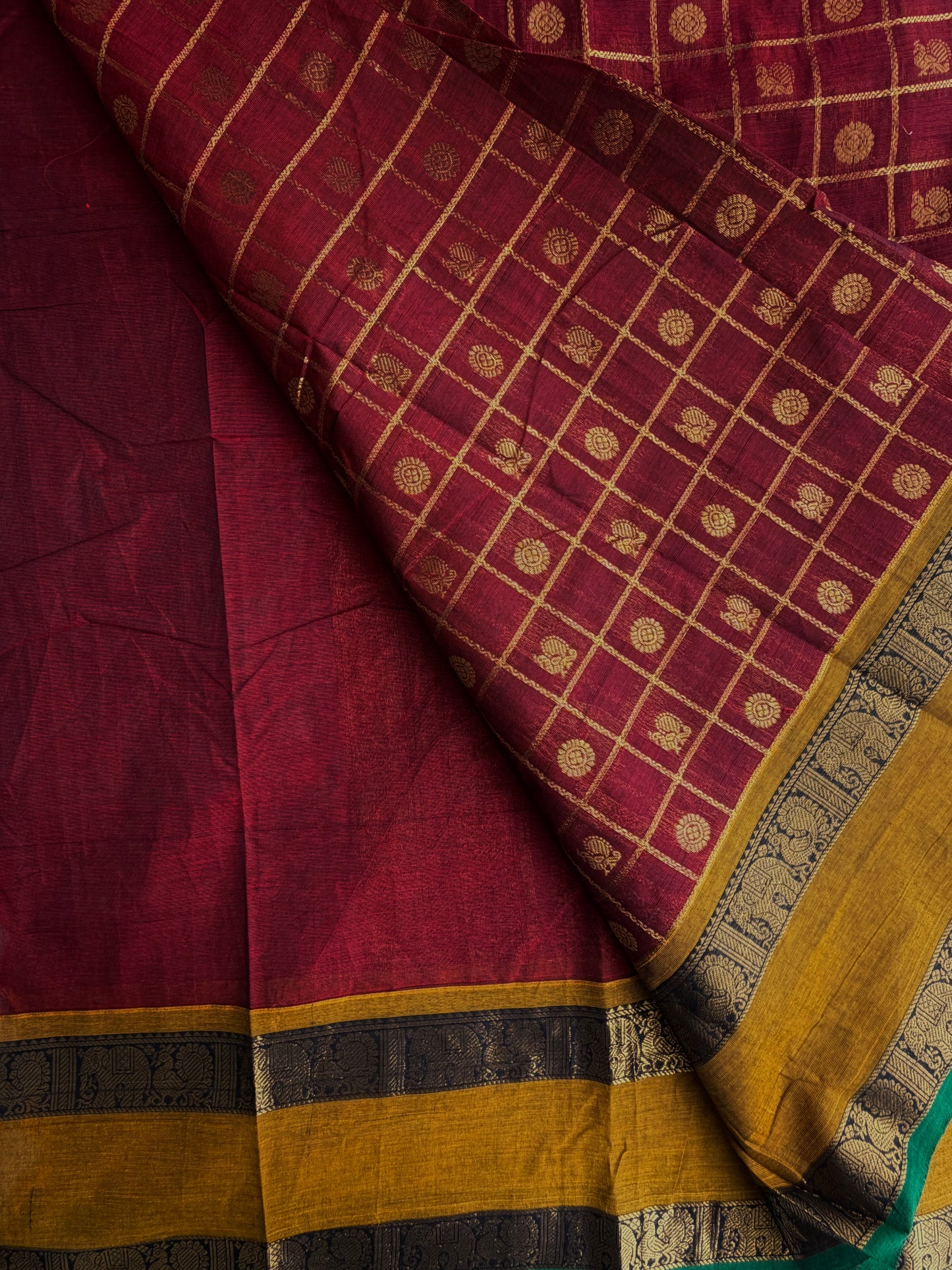 Kanchi cotton saree in zari check & butta weaves in with a grand pallu maroon