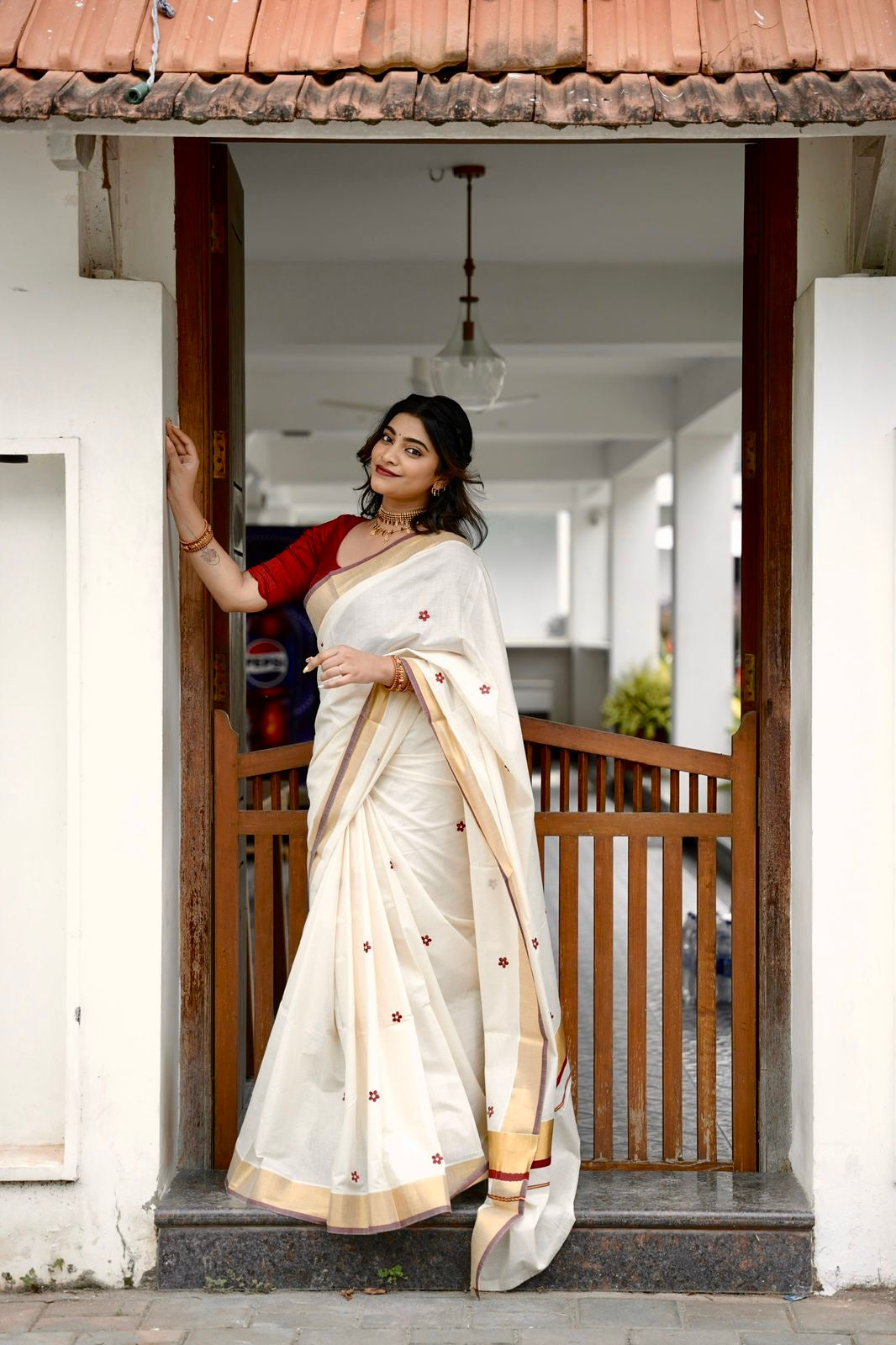 Kasavu saree in floral embroidery - maroon