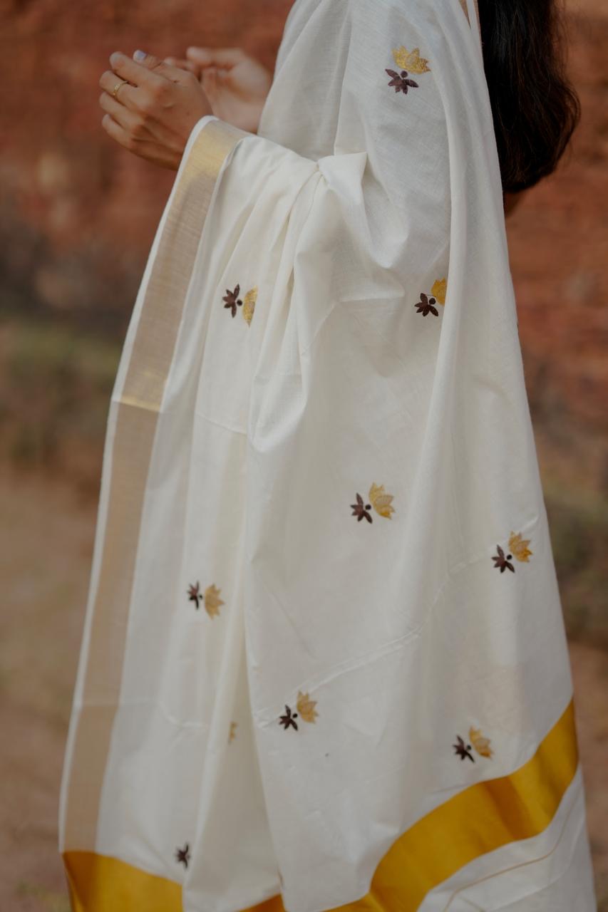 Kasavu saree in lotus embroidery
